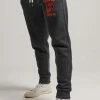 Superdry COLLEGIATE - Tracksuit Bottoms - Washed Black