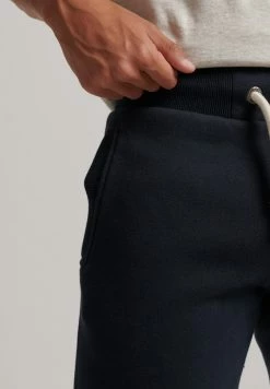 Superdry COLLEGIATE - Tracksuit Bottoms - Eclipse Navy -Superdry Shop 03733cc34aa6463f9215ce4ed382a064
