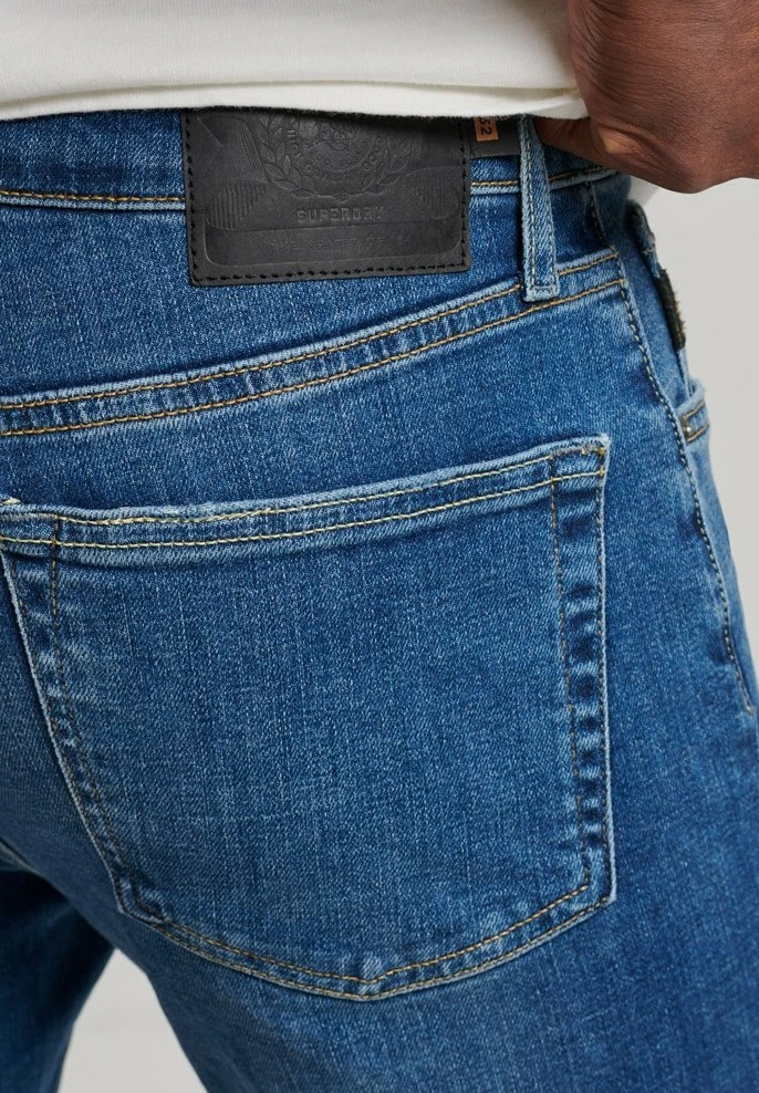 Superdry Slim Fit Jeans - Stanton Bright Blue Rip 3 Superdry Slim Fit Jeans - Stanton Bright Blue Rip - Image 3
