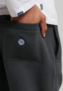 Superdry COLLEGIATE - Tracksuit Bottoms - Washed Black -Superdry Shop 2ac8f98509bb42e1994223c4fdeb5a5e