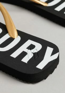 Superdry ESSENTIAL - T-bar Sandals - Black Metallic Gold -Superdry Shop bb1e5eb7947b41af8a9fb704279378e5