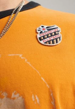 Superdry ALLSTARS BL GRAPHIC RINGER - Print T-shirt - Track Gold -Superdry Shop c024a6990a854887848eace1d0ba762f